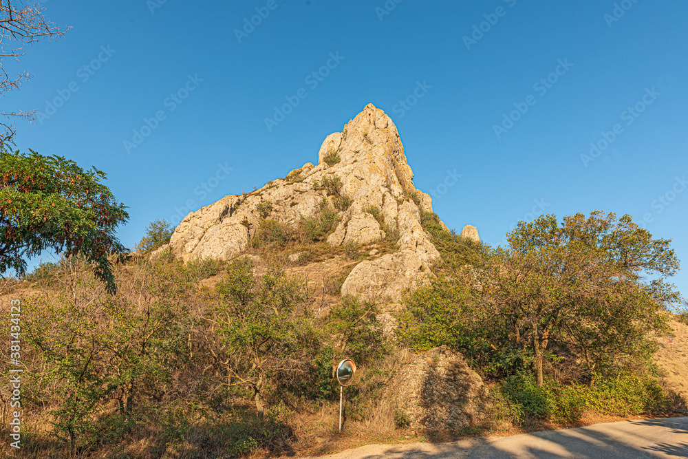 Landscape of the Crimean mountains, local attraction mount Bal Kaya in the village of Kurortnoye, the mountain serves as a landmark and a lighthouse in the daytime