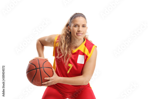 Female basketball player in a red jersey