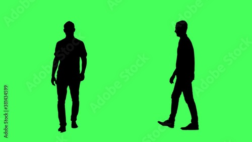 Silhouettes of confident business man walking. Side and front view. Full body on green screen chroma key background.