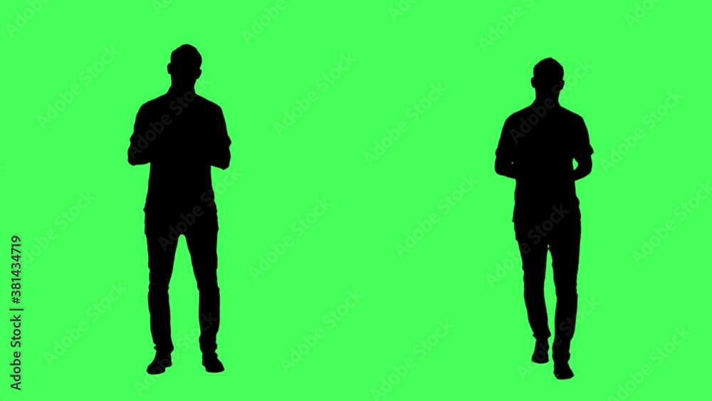 Silhouette of walking and standing business man talking and announcing. Full body on green screen chroma key background. Silhouette of walking and standing business man talking and announcing. Full body on green screen chroma key background.