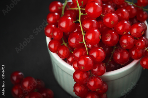 A ceramic bowl with red currant berries 