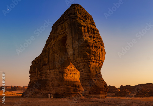 Elephant Rock natural geological formation with unidentified tourists at the base looking up, Al Ula, western Saudi Arabia  photo