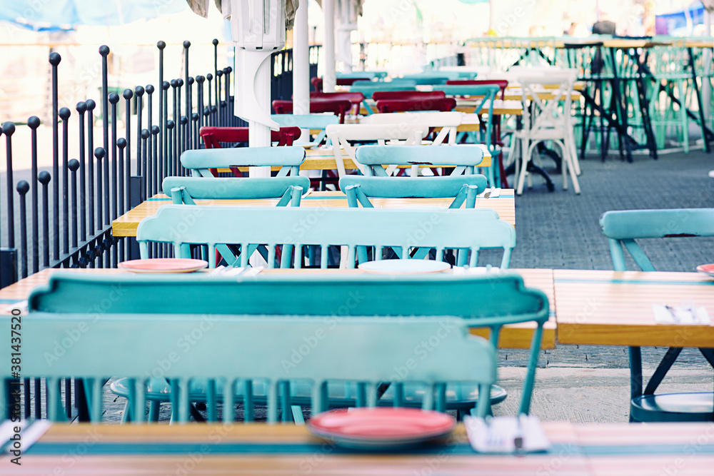 View of empty outdoor cafe. Fashioned cafe terrace.