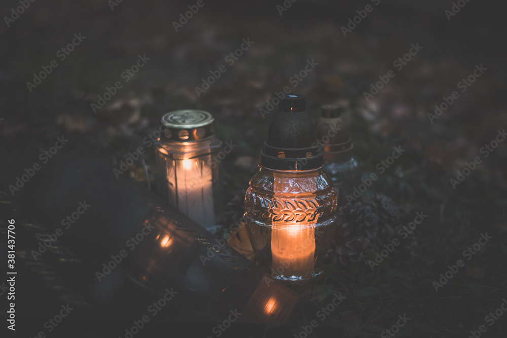 All Saints Day with burning candles in lanterns and colorful festive