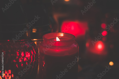 red atmosphere of burning candles in the cemetery
