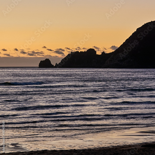 Sunset on the beach of Mar de Fora, Finisterre, Galicia, Spain. This beach is the westernmost beach in Europe, so people go there to see one of the most impressive sunsets in Northern Spain