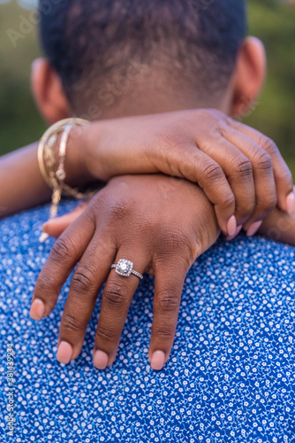 Fotografija Vertical shot of a newly engaged African-American couple