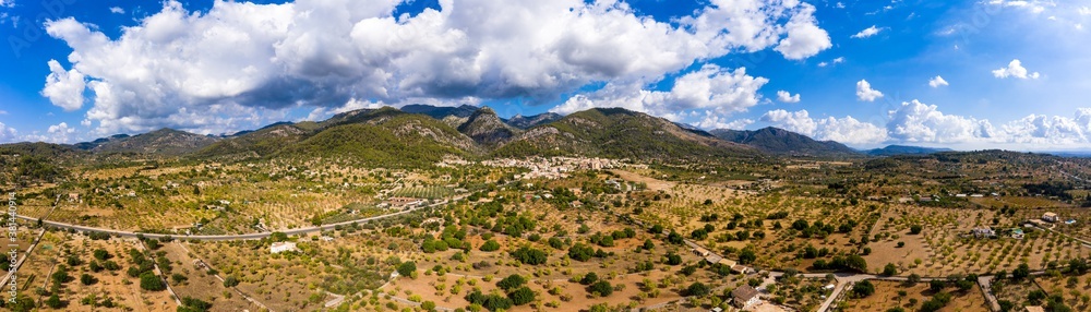 Aerial view, the village of Caimari municipality of Selva on the edge of the Tramuntana mountains with agriculture, center of the island, Mallorca, Balearic Islands, Spain