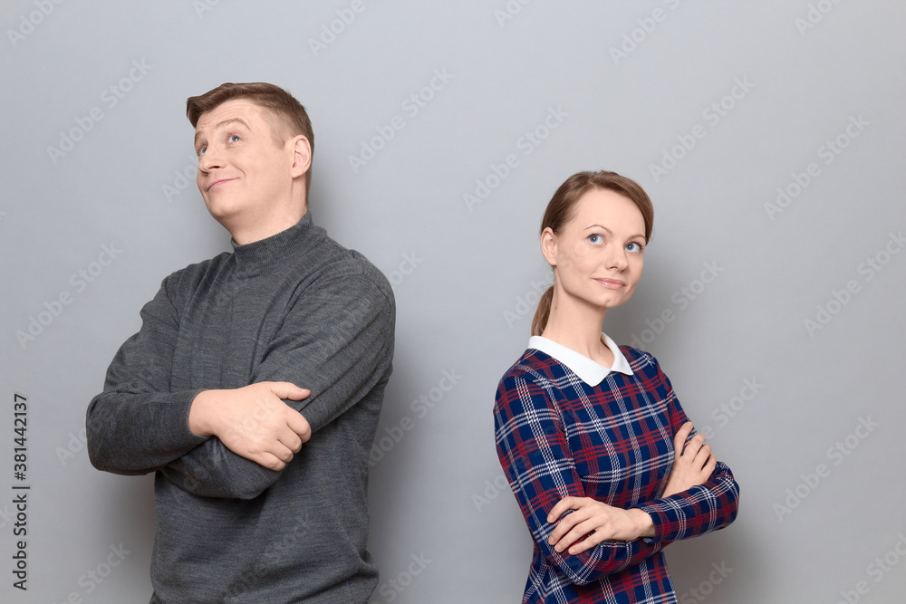 Portrait of dreamy man and woman standing next to each other Portrait of dreamy man and woman standing next to each other