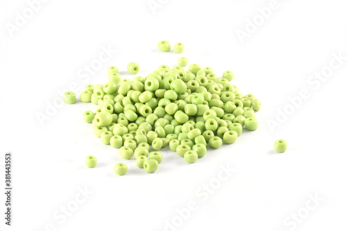 Beads spread on white background. Background or texture of beads. Close up, macro,It is used in finishing fashion clothes. make bead necklace or beads for woman of fashion,Bead Crochet. Daily Beading.