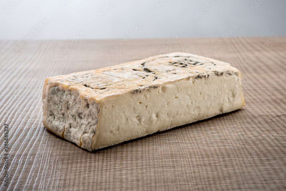 Italian aged cheese on wooden background Italian aged cheese on wooden background