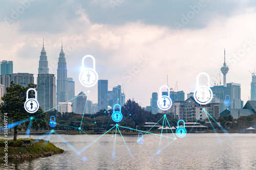 Photography Hologram of Padlock on sunset panoramic cityscape of Kuala Lumpur, Malaysia, Asia