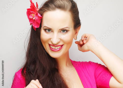 brunette with long hair in pink wear happy smiling