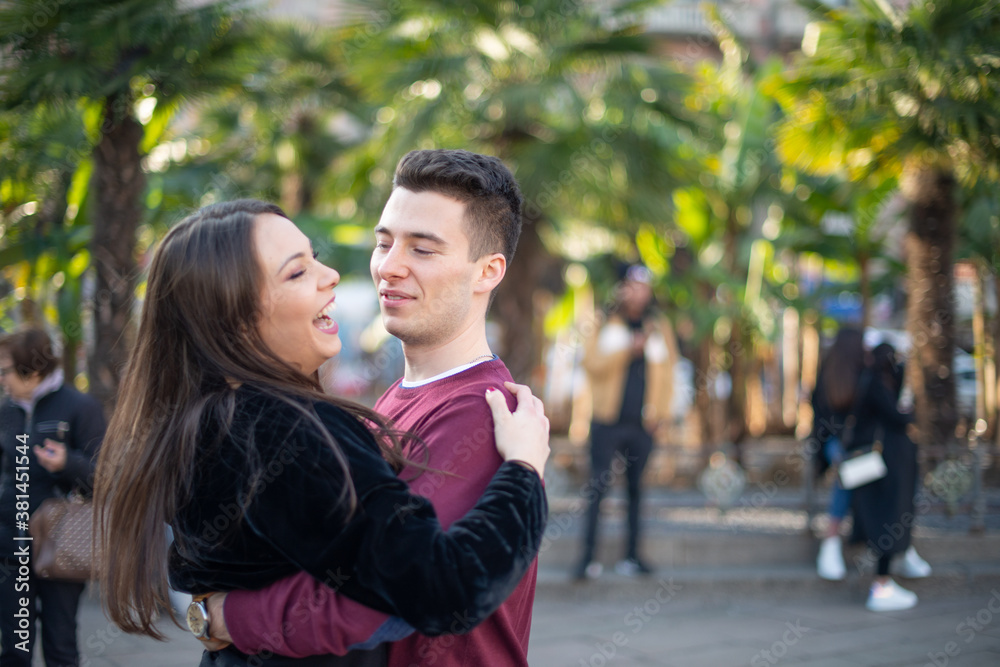 Couple hugging in a city street Couple hugging in a city street