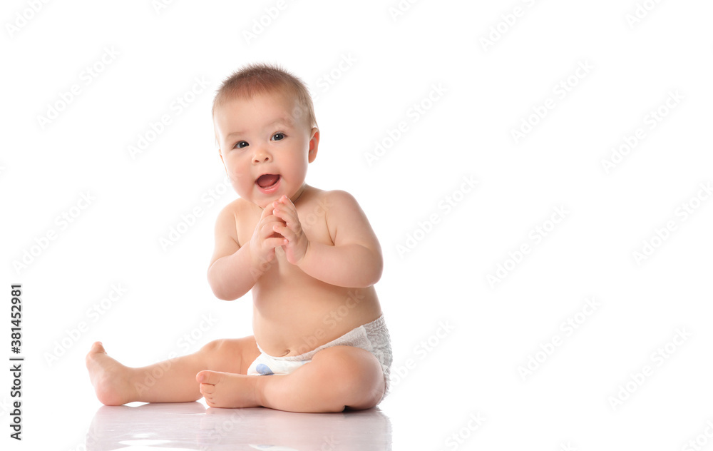 Cute little baby in diaper clapping hand on floor Cute little baby in diaper clapping hand on floor