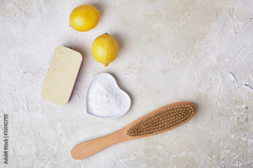 soda, lemons, sponge and wooden brush for eco cleaning, natural and non-toxic detergents, zero waste lifestyle concept