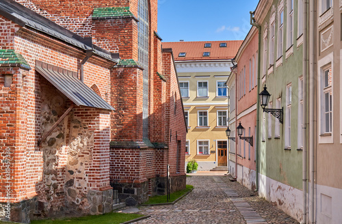 Narrow street in the town near the church 