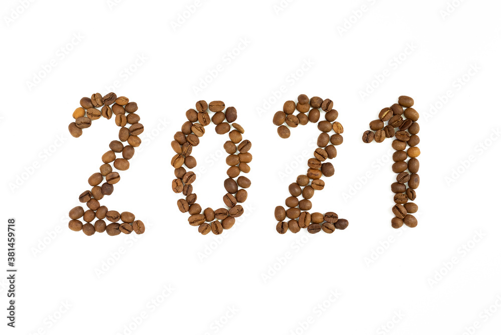 New year 2021 made of coffee beans on the white background New year 2021 made of coffee beans on the white background