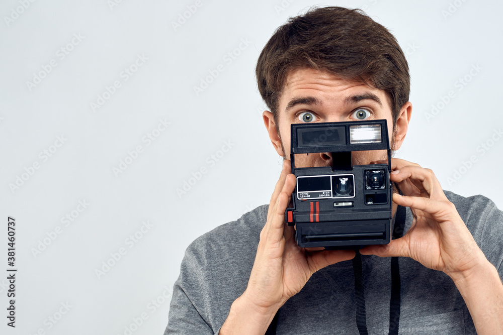 male photographer holding camera professional lens creative studio work light background male photographer holding camera professional lens creative studio work light background