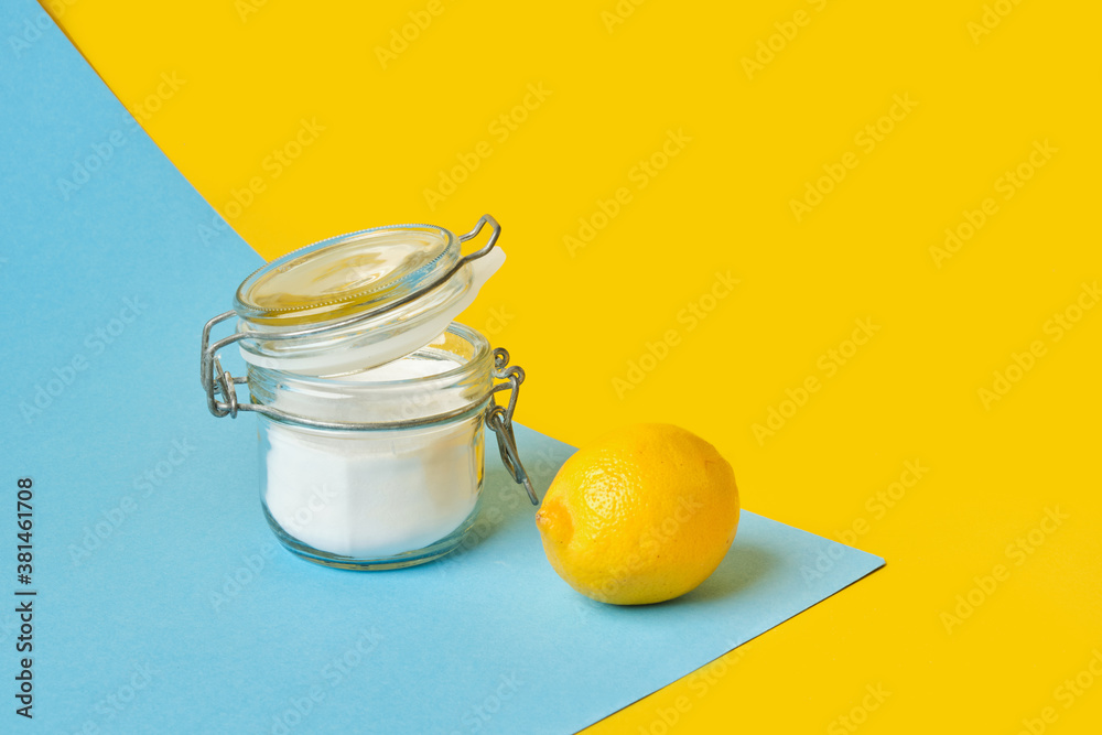 can of soda and lemon on yellow-blue background copy space can of soda and lemon on yellow-blue background copy space