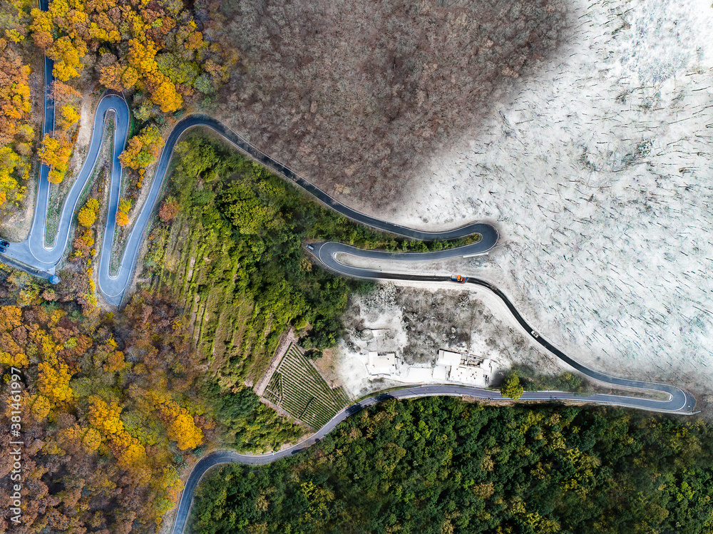 Seasons Concept summer winter fall spring Aerial view Winding road serpentine mountain pass village Brodenbach Germany