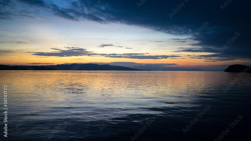 Beautiful dramatic sunset over the sea. Evening on the ocean. Freedom, peace and meditation concept. Soft focus