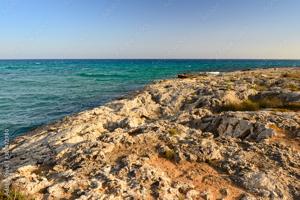 rocky beach on the blue sea on a Sunny evening
