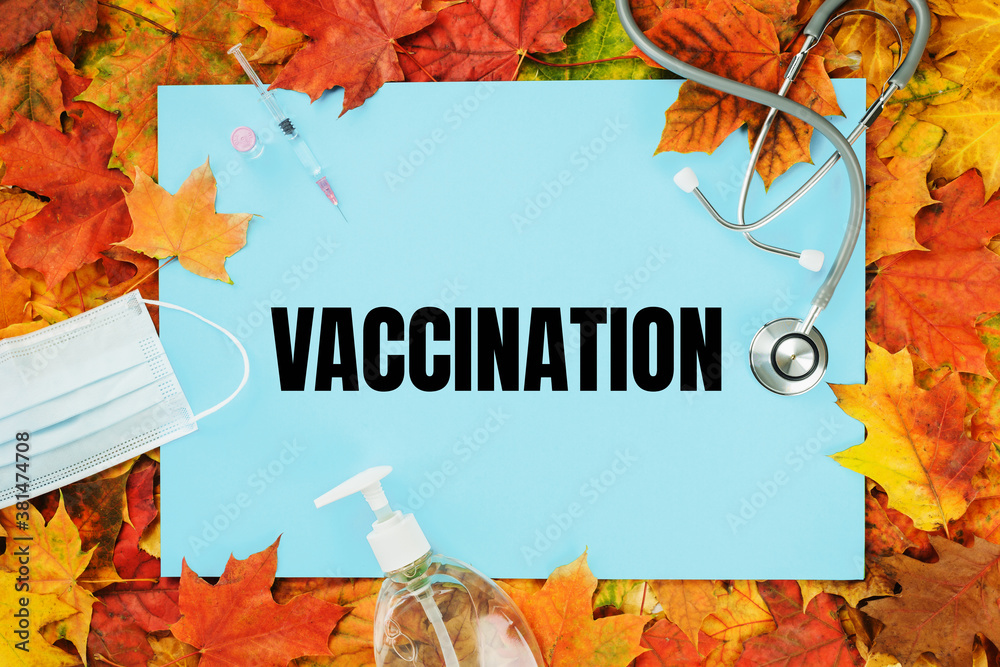 Fotografie vaccination text on blue with fall leaves