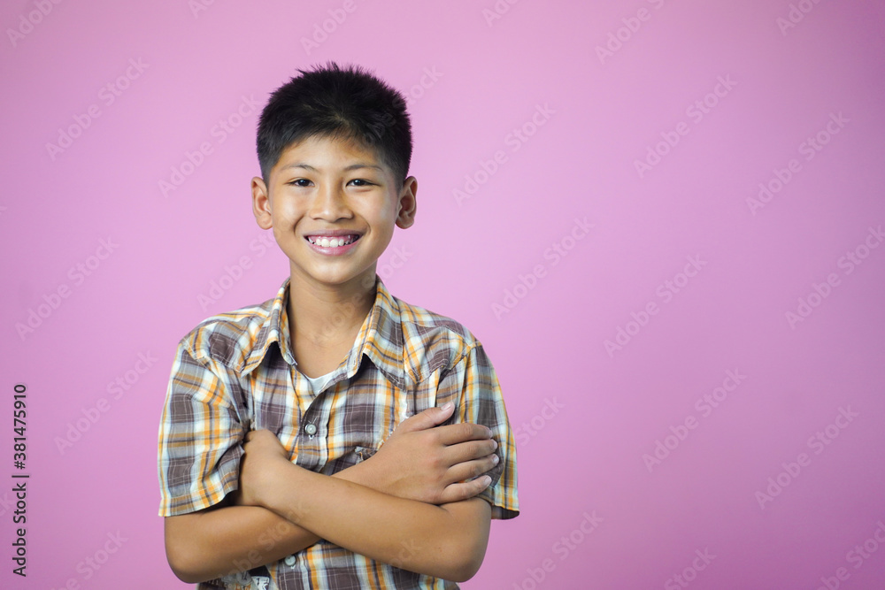 Portrait of happy smiling asian child boy isolated on pink background. Portrait of happy smiling asian child boy isolated on pink background.