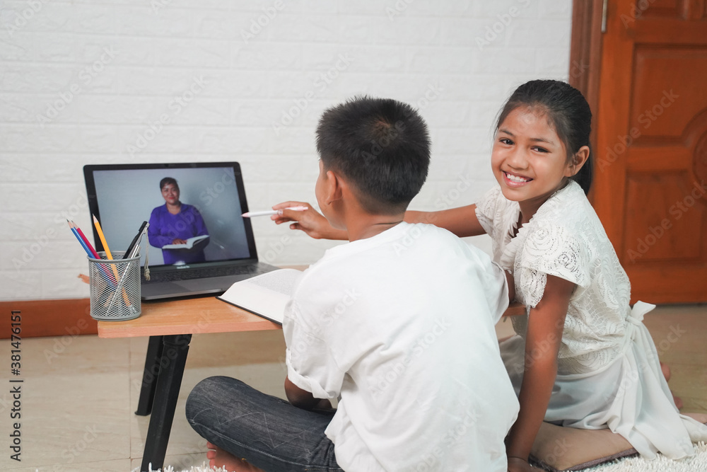 Happy Asian boy and girl student online learning with laptop at home. class study online video call. Social distance, home schooler, New normal, Covid-19, Stay home. Happy Asian boy and girl student online learning with laptop at home. class study online video call. Social distance, home schooler, New normal, Covid-19, Stay home.