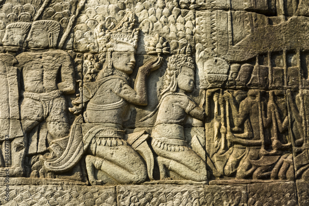 Detail of bas relief depicting worship of king on the Bayon , Angkor Thom, Siem Reap