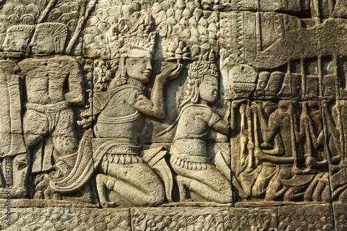 Detail of bas relief depicting worship of king on the Bayon , Angkor Thom, Siem Reap