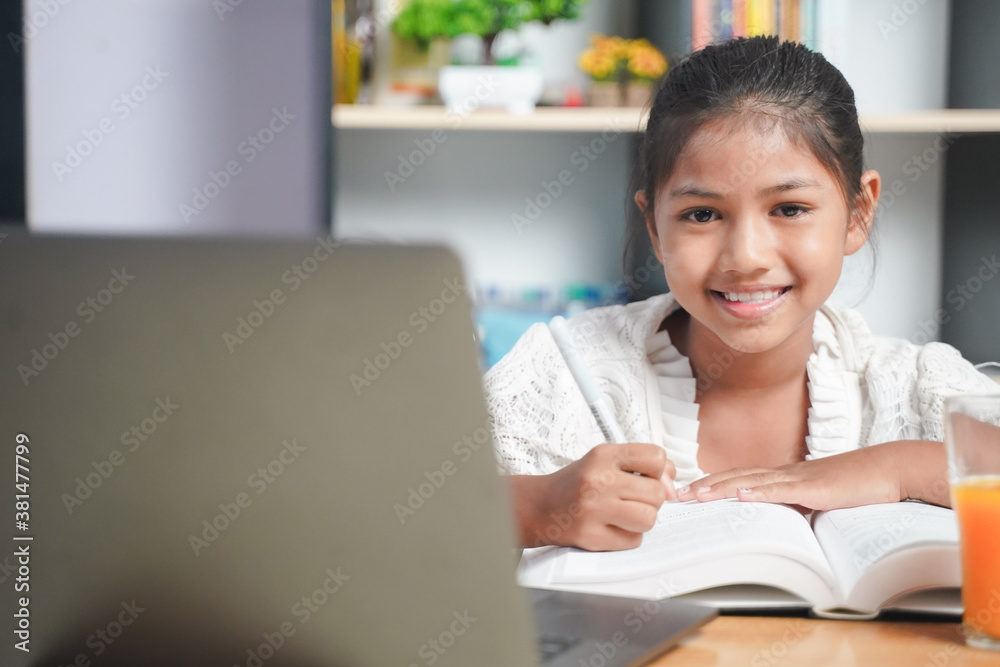 Happy Asian girl student online learning with laptop at home. class study online video call. Social distance, home schooler, New normal, Covid-19, Stay home. Happy Asian girl student online learning with laptop at home. class study online video call. Social distance, home schooler, New normal, Covid-19, Stay home.