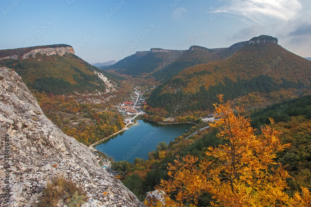 Beautiful autumn landscape with mountains and mountain lake. The colors of autumn.