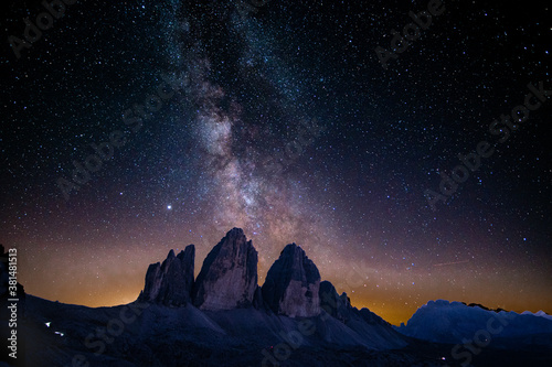 Milky way night sky above the famous mountain range "Tre Cime" in the Dolomites in South Tyrol in Italy