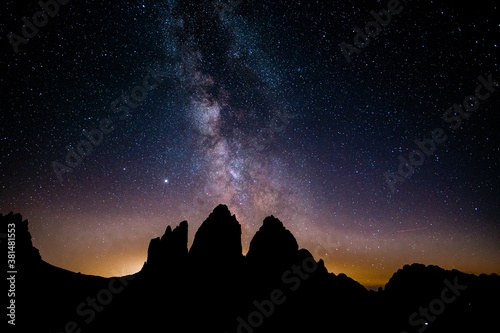 Milky way night sky above the famous mountain range "Tre Cime" in the Dolomites in South Tyrol in Italy