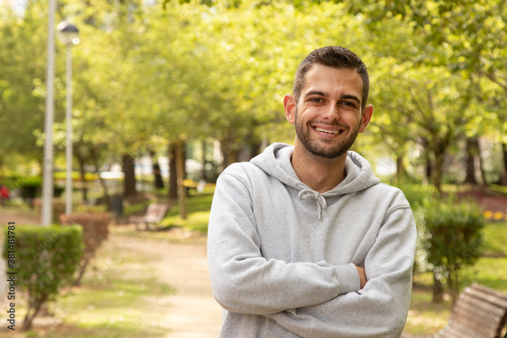 portrait of attractive young man with beard outdoors