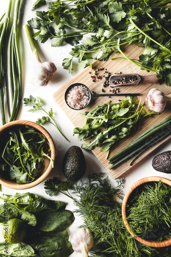 Green vegetables and fruits, avocado, lime, cabbage, parsley, cucumber, dill, onion ,salad, spinach