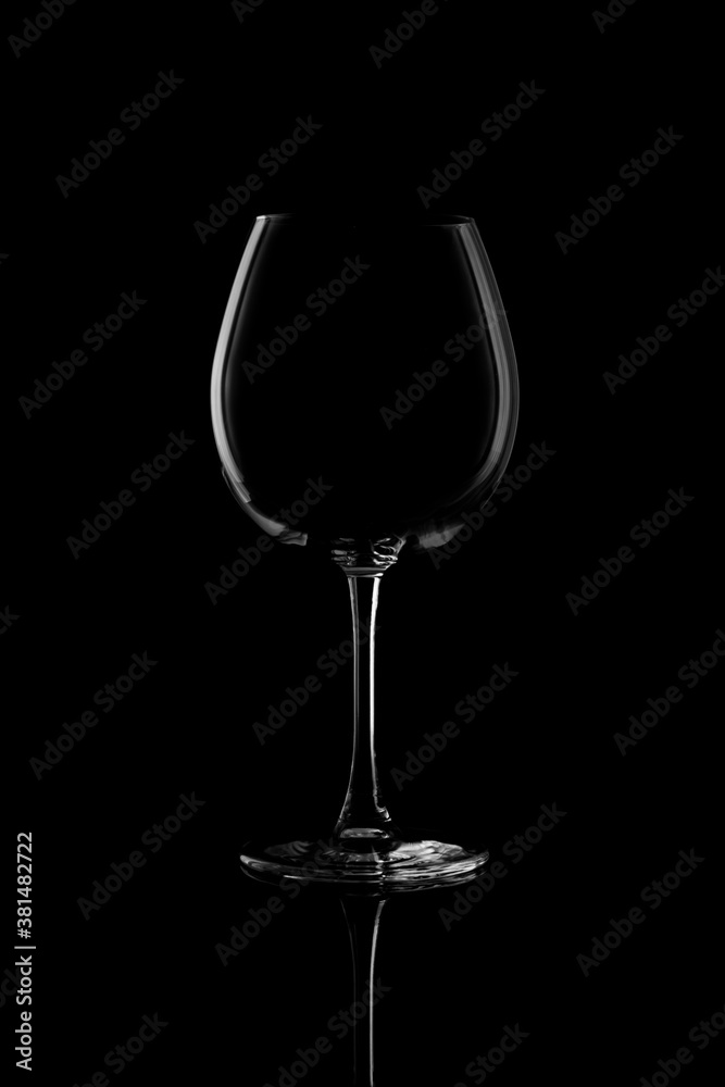 Empty wine glass isolated on black background