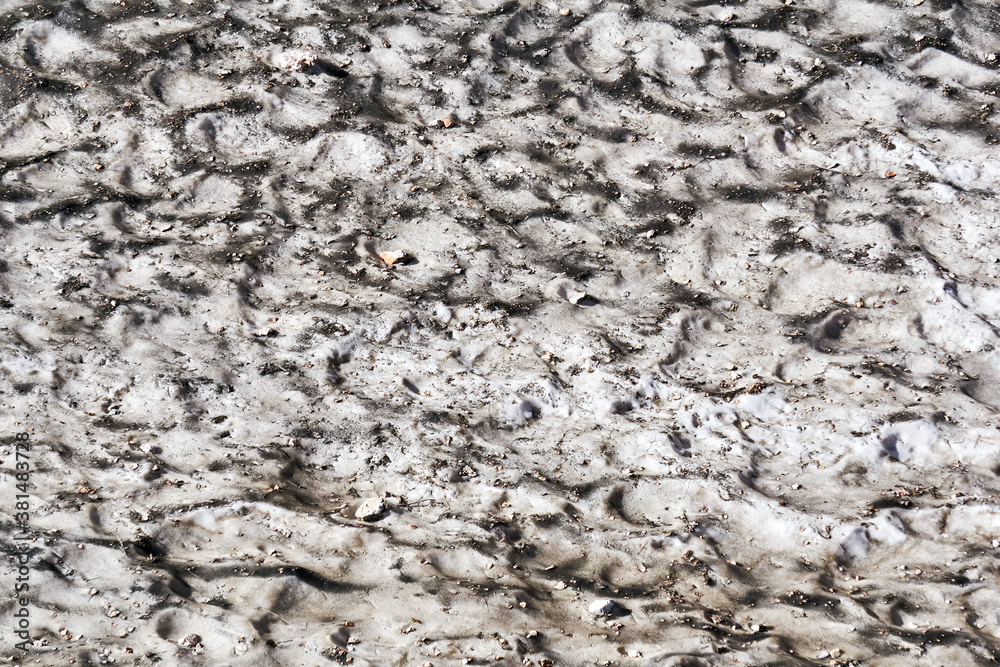 surface of a melting mountain glacier covered with stones and rubble surface of a melting mountain glacier covered with stones and rubble