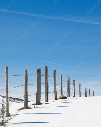 Snowy horizon with a fence