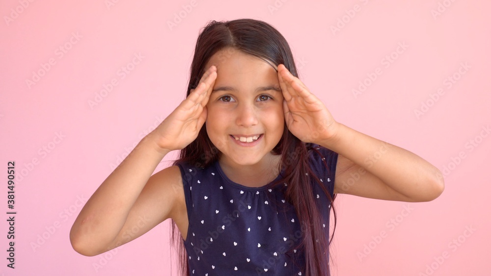 Girl playing hide and seek portrait. Cute little girl open her face with hands. Playing hide and seek Girl playing hide and seek portrait. Cute little girl open her face with hands. Playing hide and seek