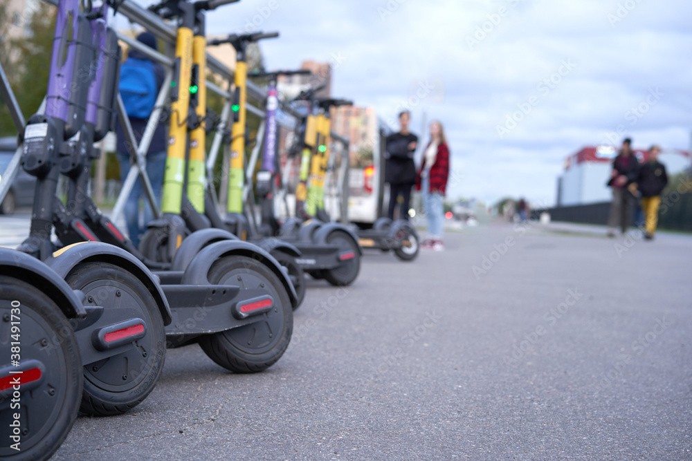 Fototapeta premium Mobile app for electric scooter rental, scooter Parking, as a business