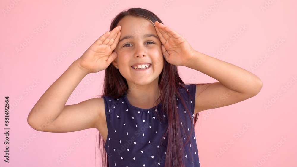 Girl playing hide and seek portrait. Cute little girl open her face with hands. Playing hide and seek Girl playing hide and seek portrait. Cute little girl open her face with hands. Playing hide and seek