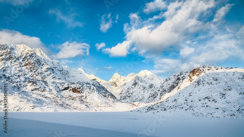Fabulous winter scenery with lots of snow  and snowy  mountain peaks near Bostad. © pilat666