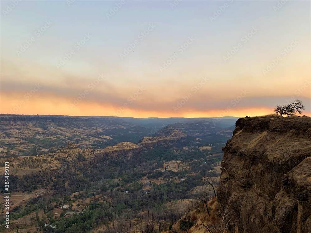California Wild Fires Smoky sunrise over the mountains;  Butte Creek Watershed Overlook