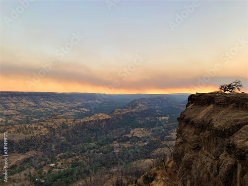 California Wild Fires Smoky sunrise over the mountains; Butte Creek Watershed Overlook