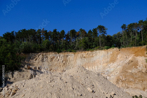 sandstone quarry in the middle of the woods photo