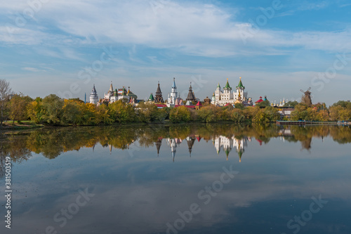 Izmailovo Kremlin and its reflection in a pond in early autumn. View from the side of Izmailovsky Island