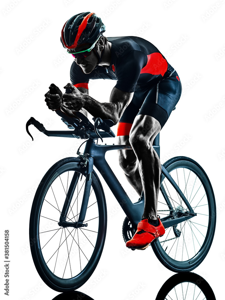 Naklejka premium triathlete triathlon Cyclist cycling in studio silhouette shadow isolated on white background